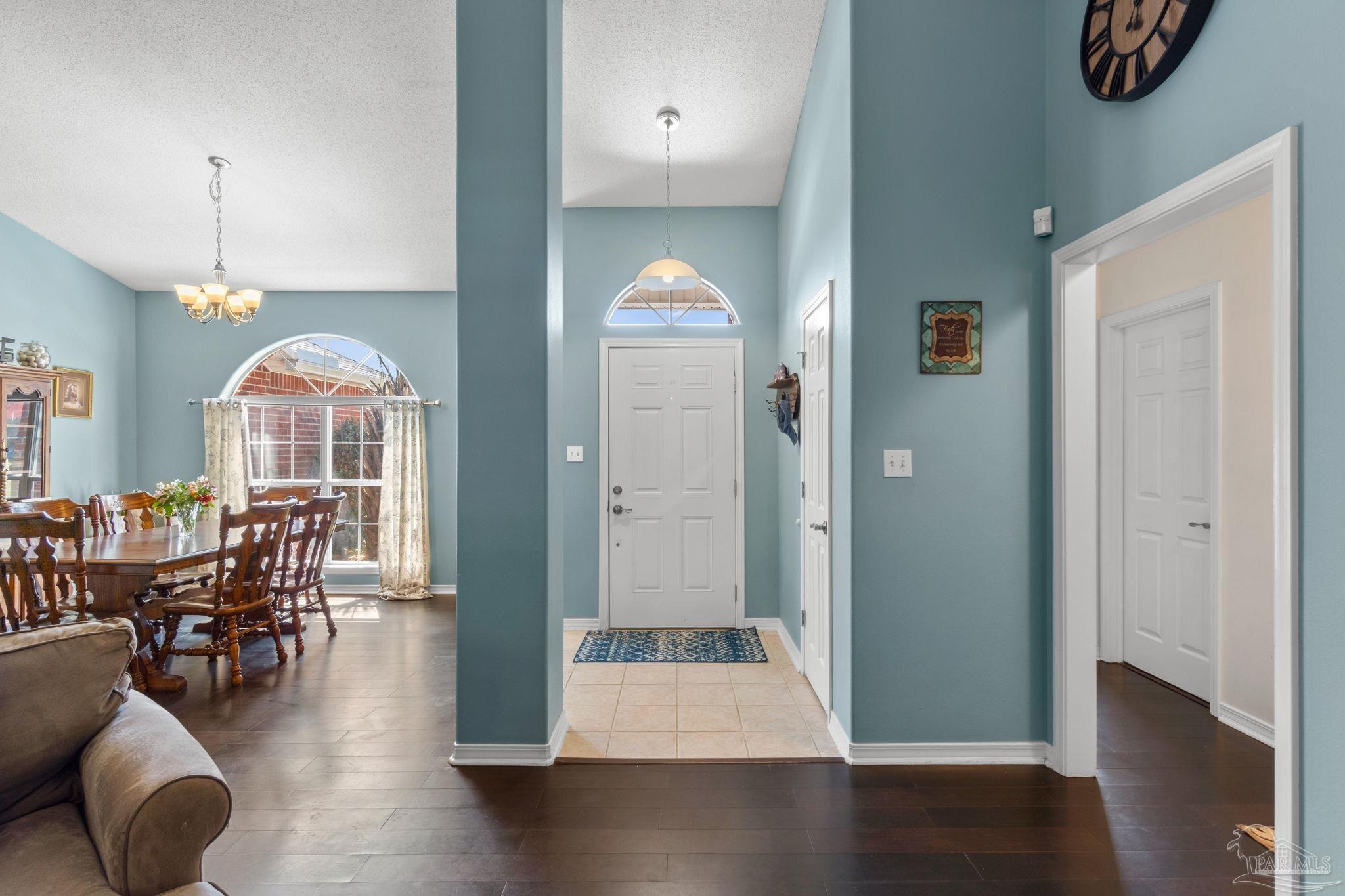 8046 Castle Pointe Way Pensacola, FL 32506 - Photo 6 of 40 wooden floor in living room with dining room and wooden floor