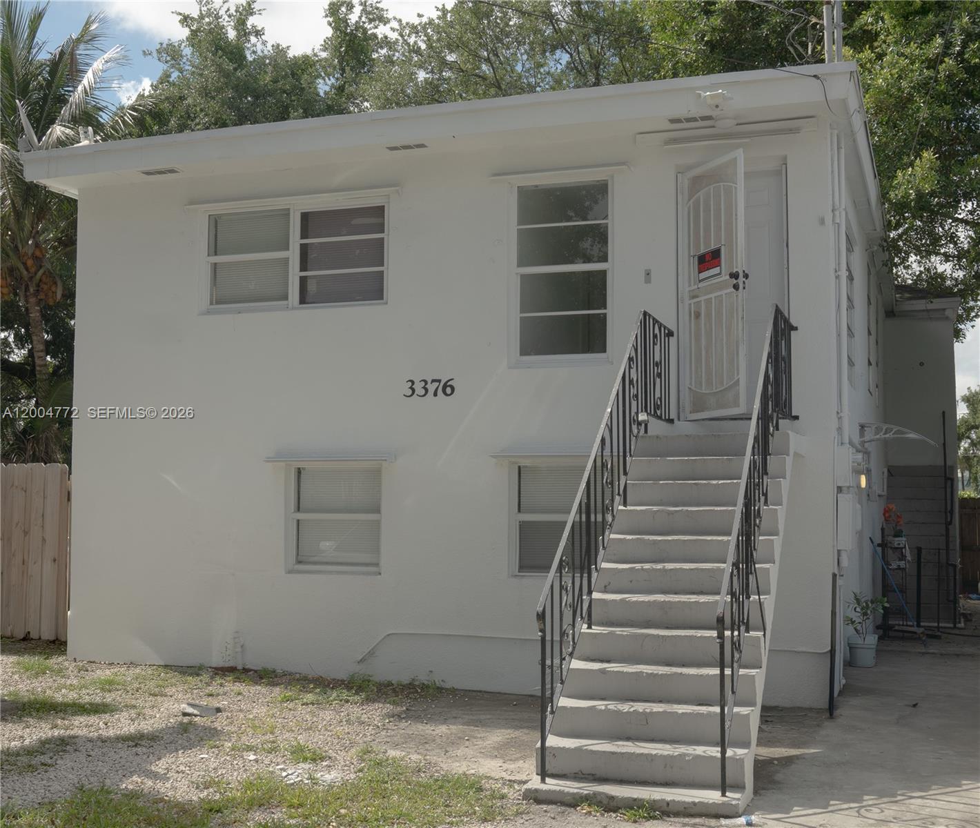 3376 Northwest 49th Street Miami, FL 33142 - Photo 1 of 17 a view of entryway with stairs