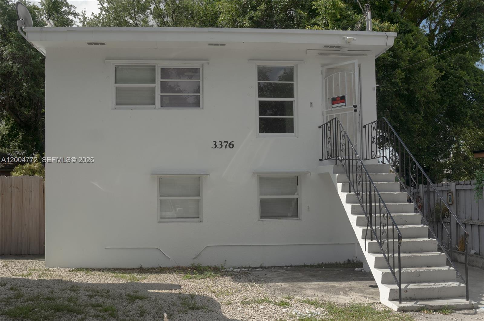 3376 Northwest 49th Street Miami, FL 33142 - Photo 2 of 17 a view of a house with a yard