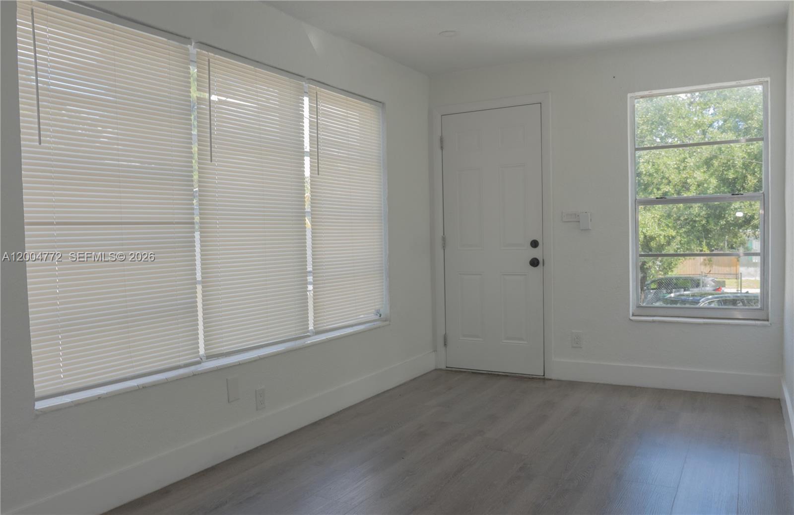 3376 Northwest 49th Street Miami, FL 33142 - Photo 5 of 17 an empty room with a window