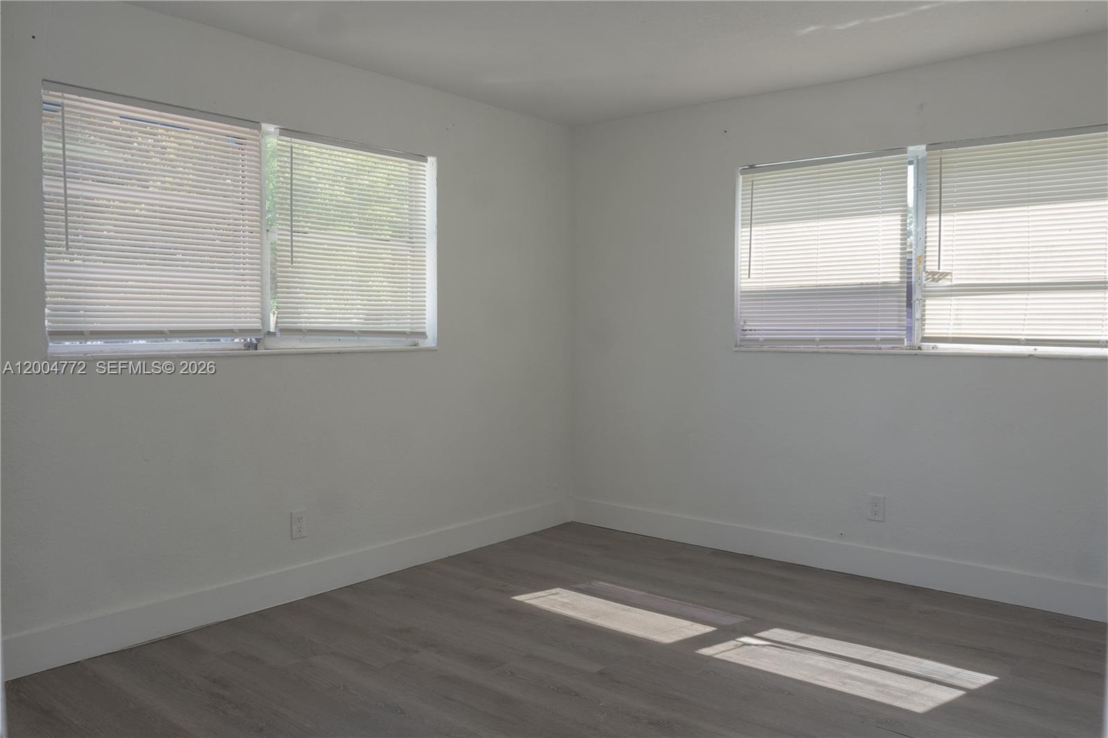 3376 Northwest 49th Street Miami, FL 33142 - Photo 6 of 17 an empty room with a window