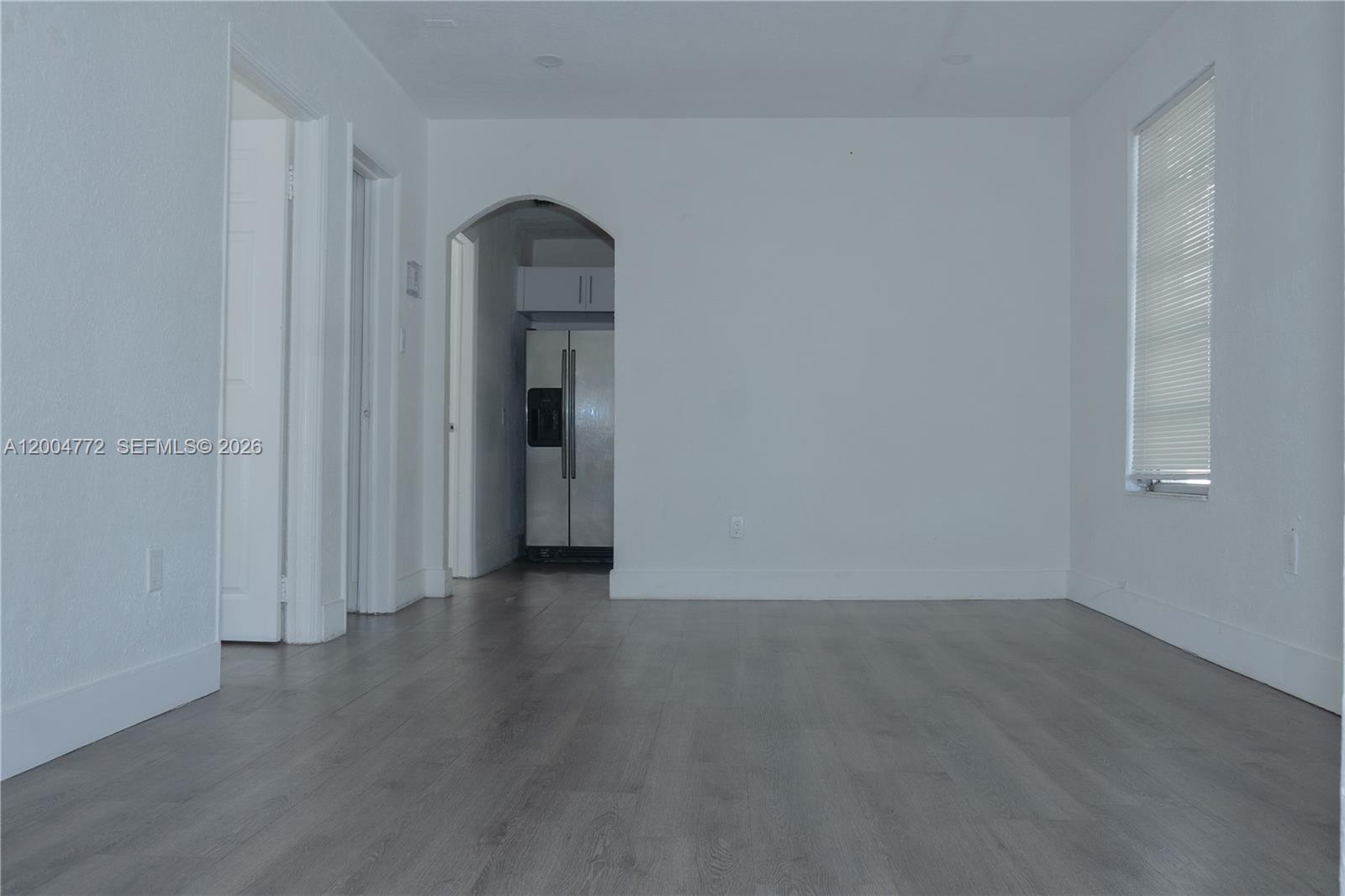 3376 Northwest 49th Street Miami, FL 33142 - Photo 8 of 17 an empty room with wooden floor and closet