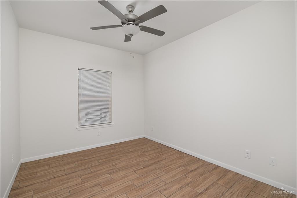524 King Road, Unit 10 San Juan, TX 78589 - Photo 11 of 12 an empty room with a empty space and a ceiling fan