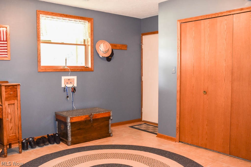 3211 Reimer Road Barberton, OH 44203 - Photo 16 of 24 Bonus room on the lower level with fantastic closet space, would make a great mud room, office or hobby room.