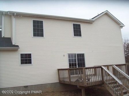 1815 Clover Road South Long Pond, PA 18334 - Photo 2 of 7 a view of a house with a balcony