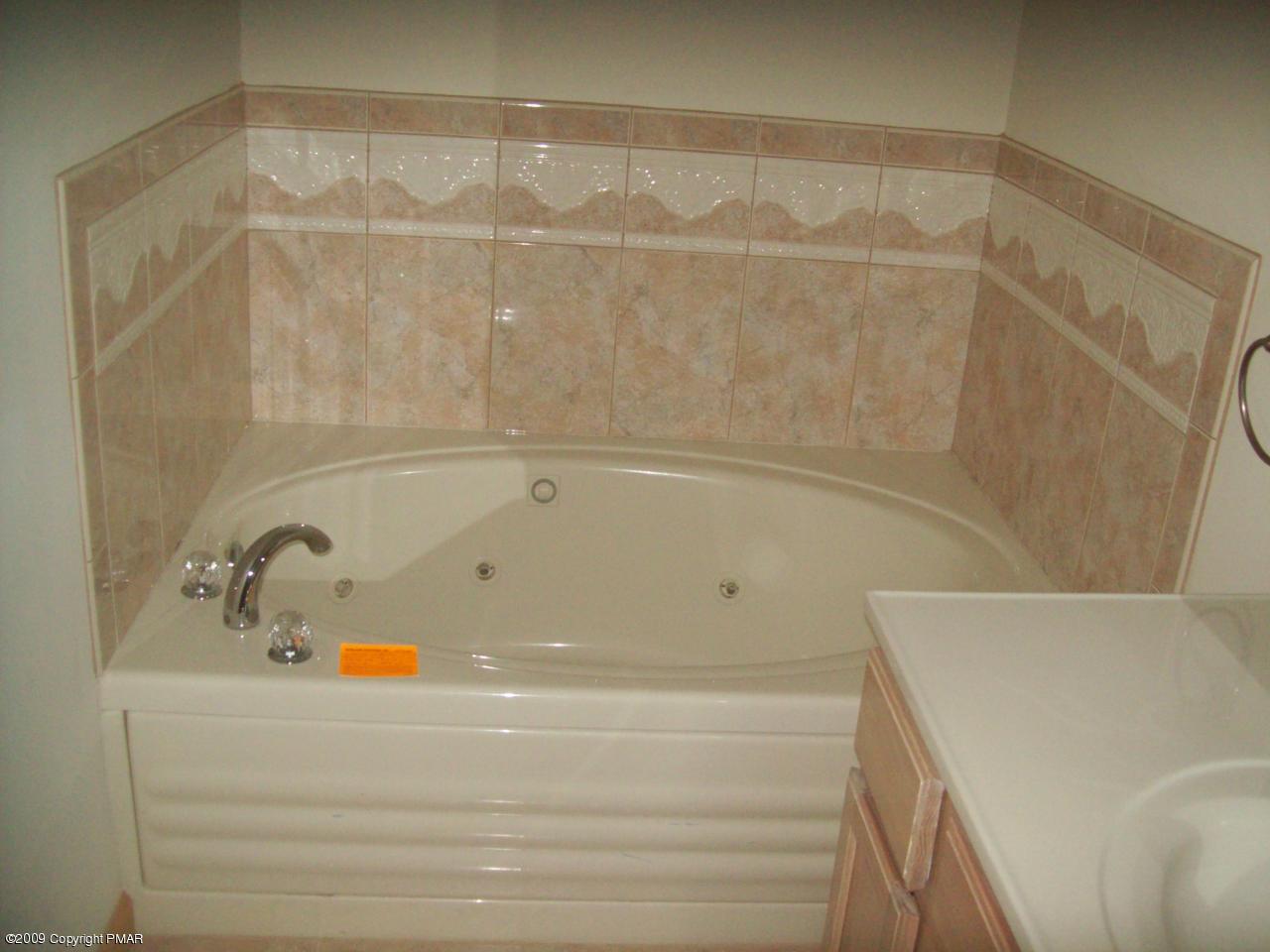 1815 Clover Road South Long Pond, PA 18334 - Photo 6 of 7 a bathroom with a bathtub and a shower