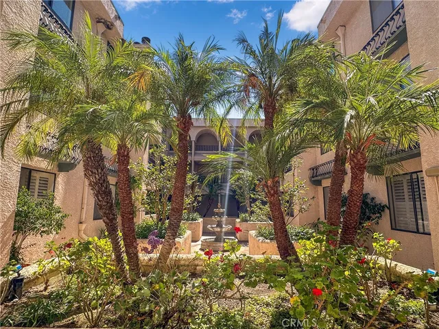 front view of a house with a tree