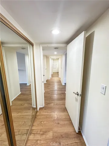 wooden floor in an empty room with a fireplace