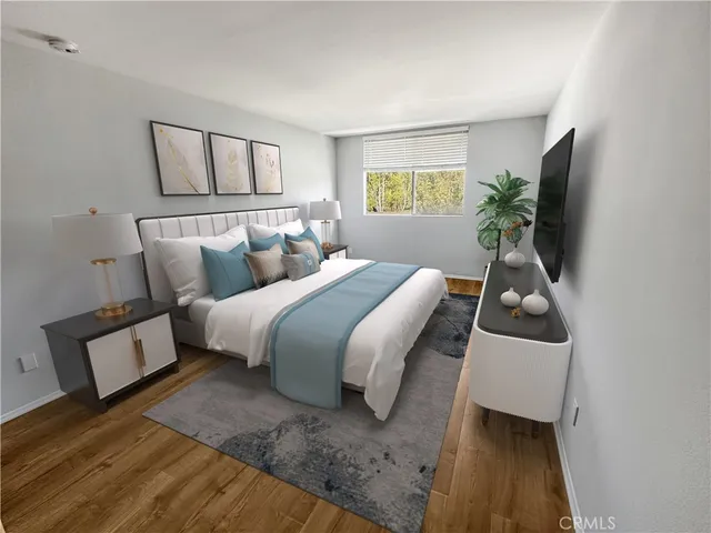 a bedroom with a bed and a window