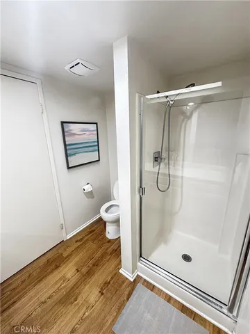 a bathroom with a glass shower door