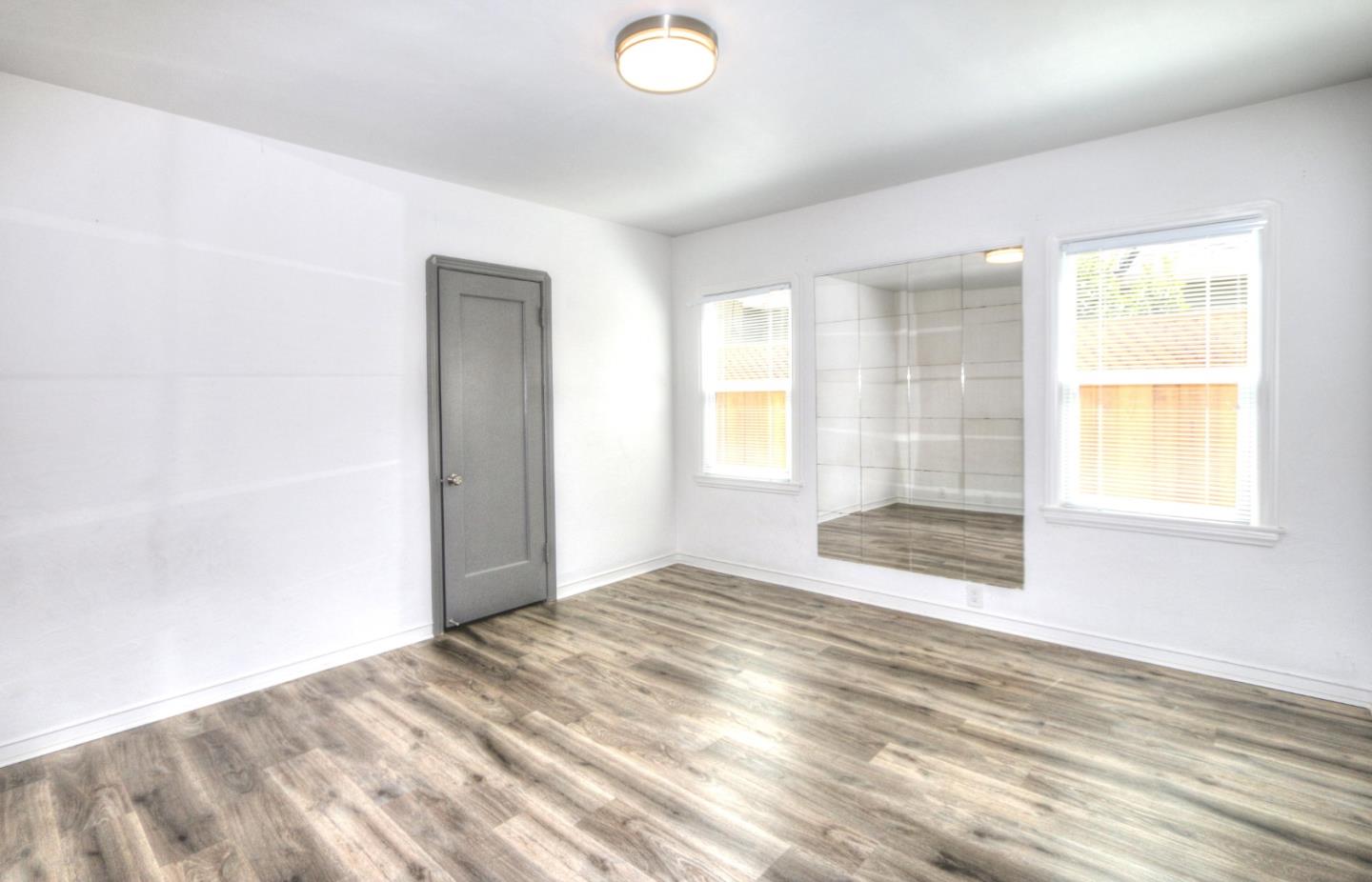 553 Rutland Avenue San Jose, CA 95128 - Photo 12 of 20 an empty room with windows