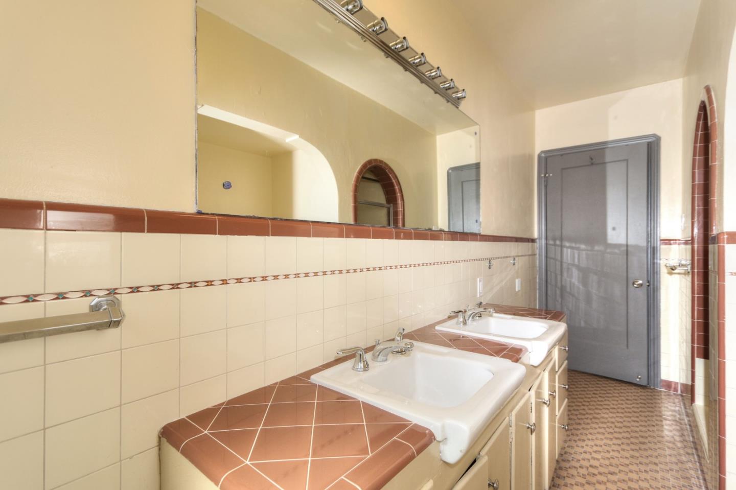 553 Rutland Avenue San Jose, CA 95128 - Photo 13 of 20 a bathroom with a sink and a mirror