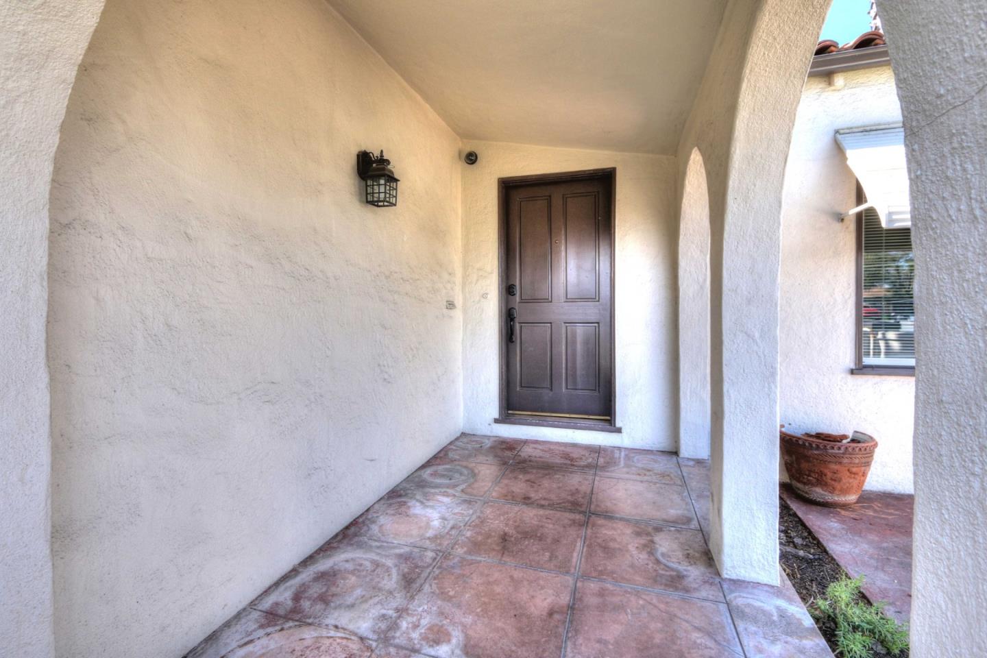 553 Rutland Avenue San Jose, CA 95128 - Photo 4 of 20 a view of a hallway and a livingroom with furniture