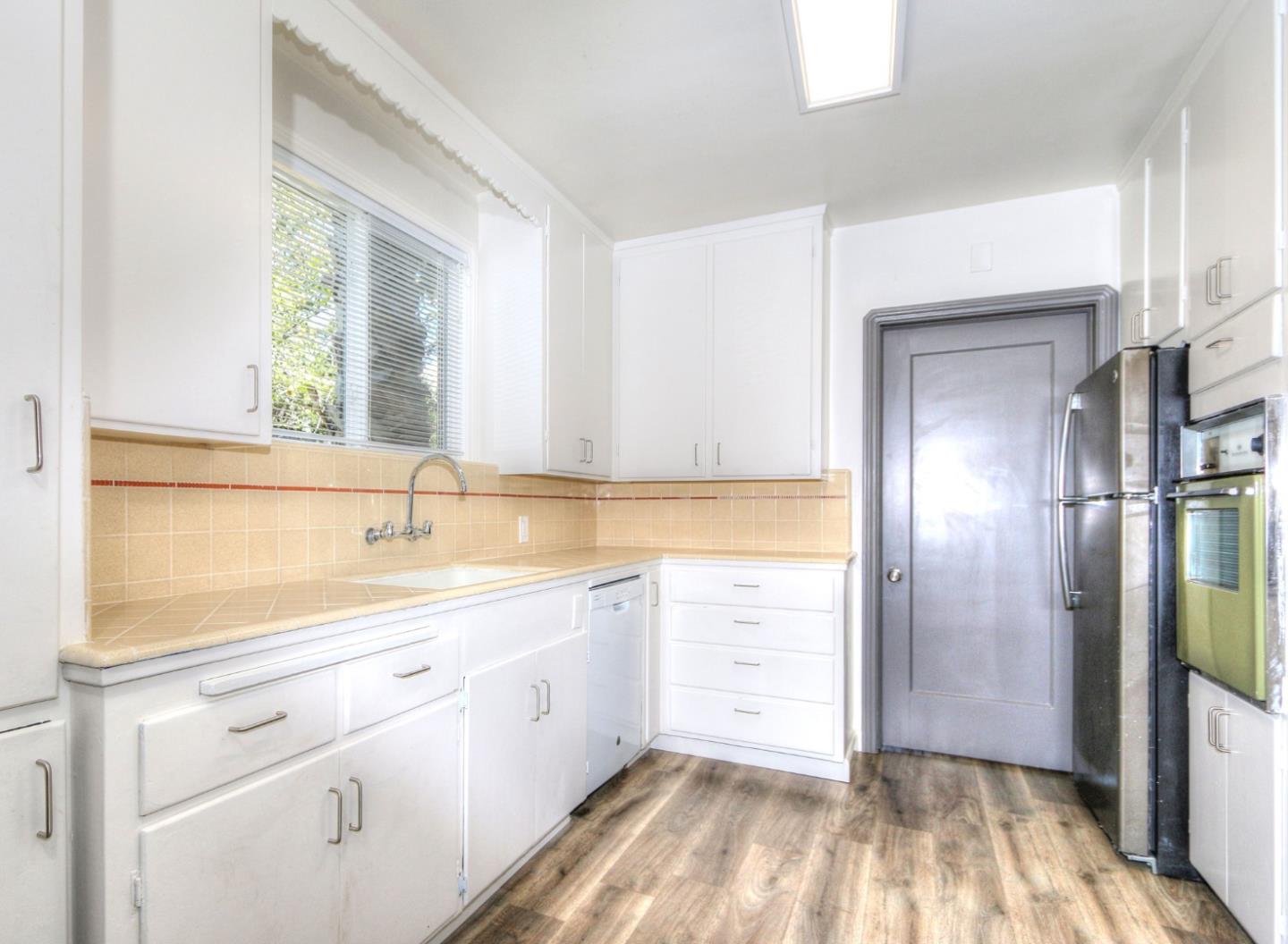 553 Rutland Avenue San Jose, CA 95128 - Photo 9 of 20 a bathroom with a sink a mirror and a shower