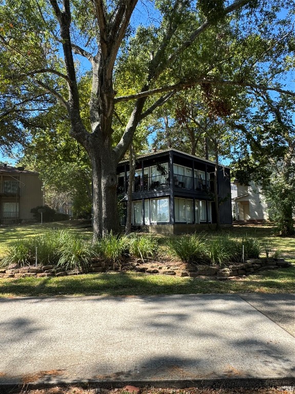 1425 April Villas Conroe, TX 77356 - Photo 4 of 21 a front view of a house with a garden