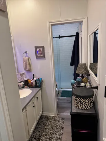 a bathroom with a sink toilet and mirror