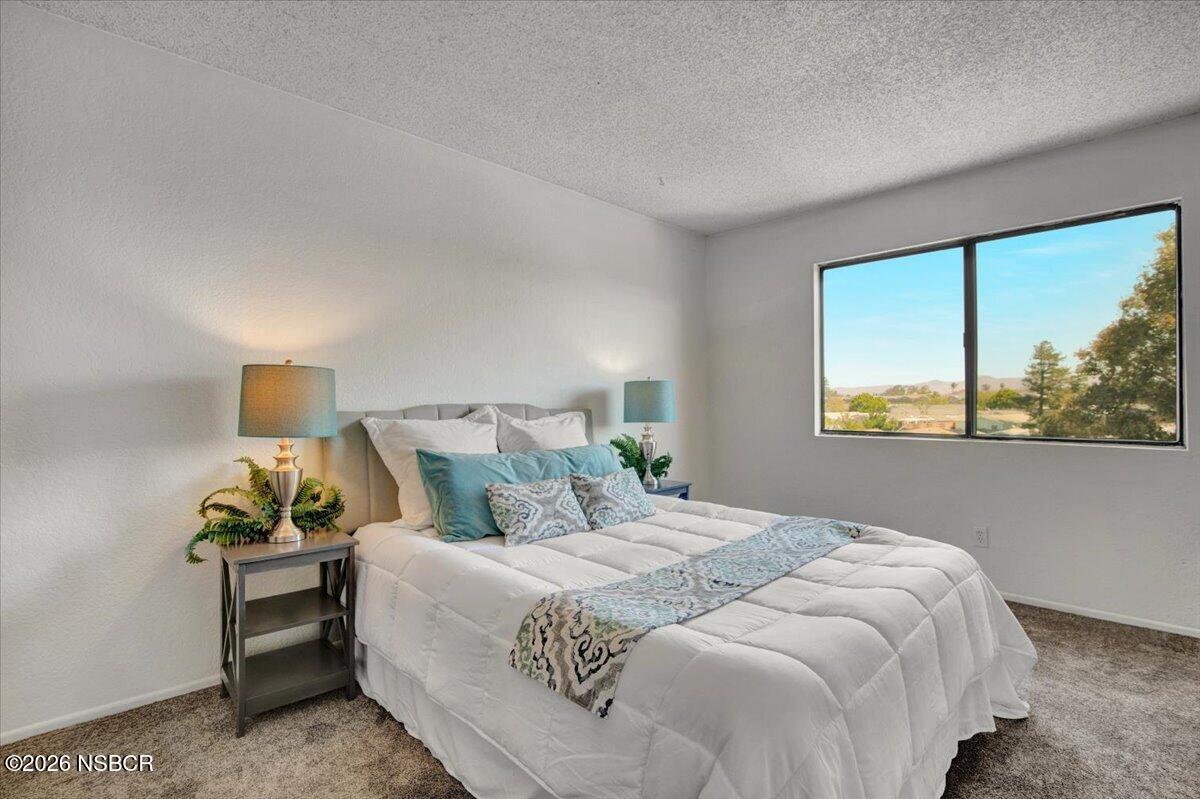 3400 Santa Maria Way, Unit 207B Santa Maria, CA 93455 - Photo 32 of 50 a bedroom with a bed and window