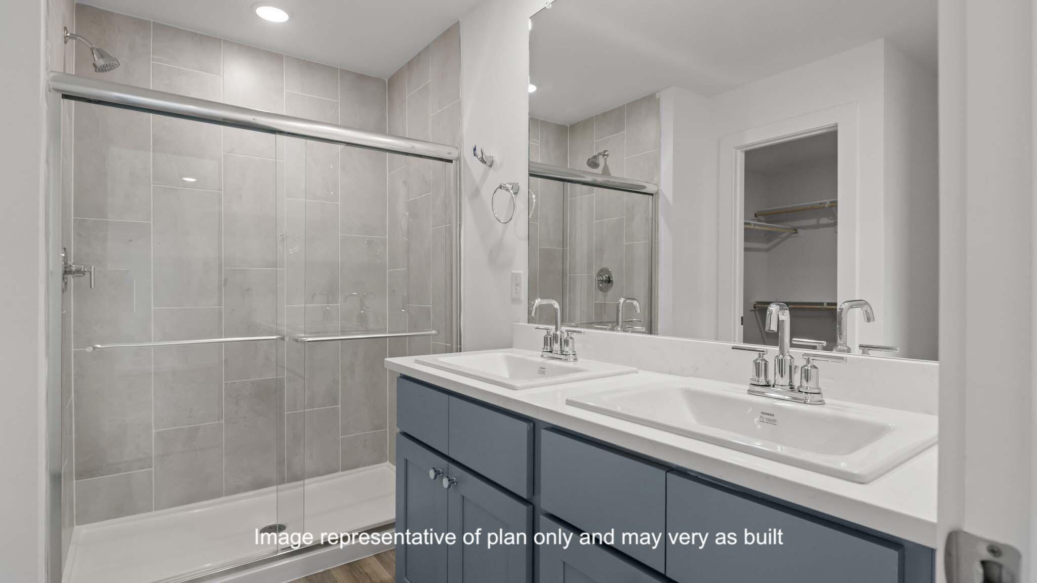 617 East 15th Street Wolfforth, TX 79382 - Photo 19 of 33 a bathroom with a sink double vanity and shower