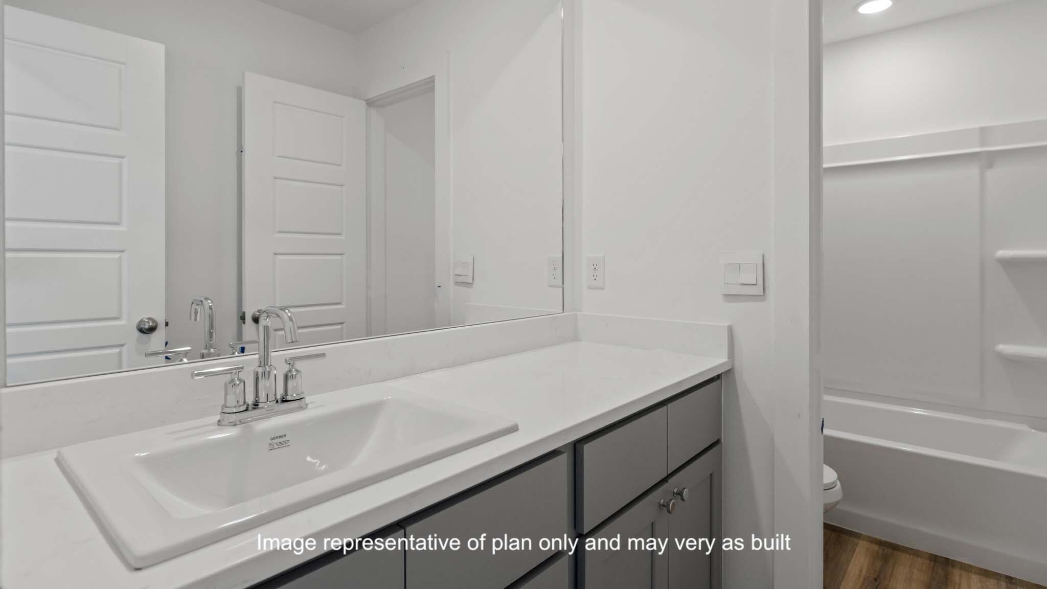 617 East 15th Street Wolfforth, TX 79382 - Photo 26 of 33 a bathroom with a sink and a bathtub
