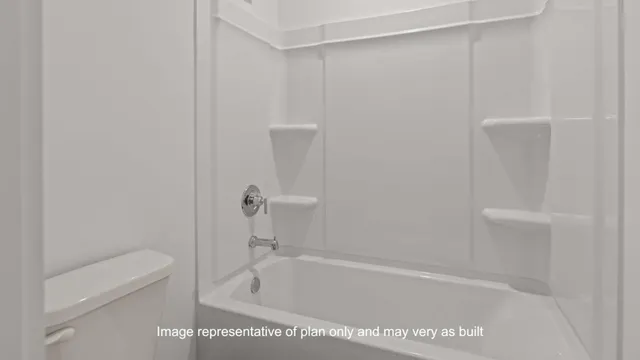 a bath tub sitting next to a white toilet