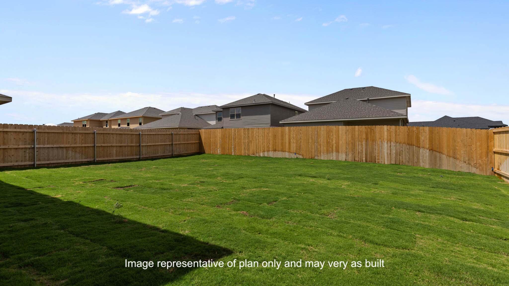 617 East 15th Street Wolfforth, TX 79382 - Photo 32 of 33 a view of a backyard with a garden and wooden fence