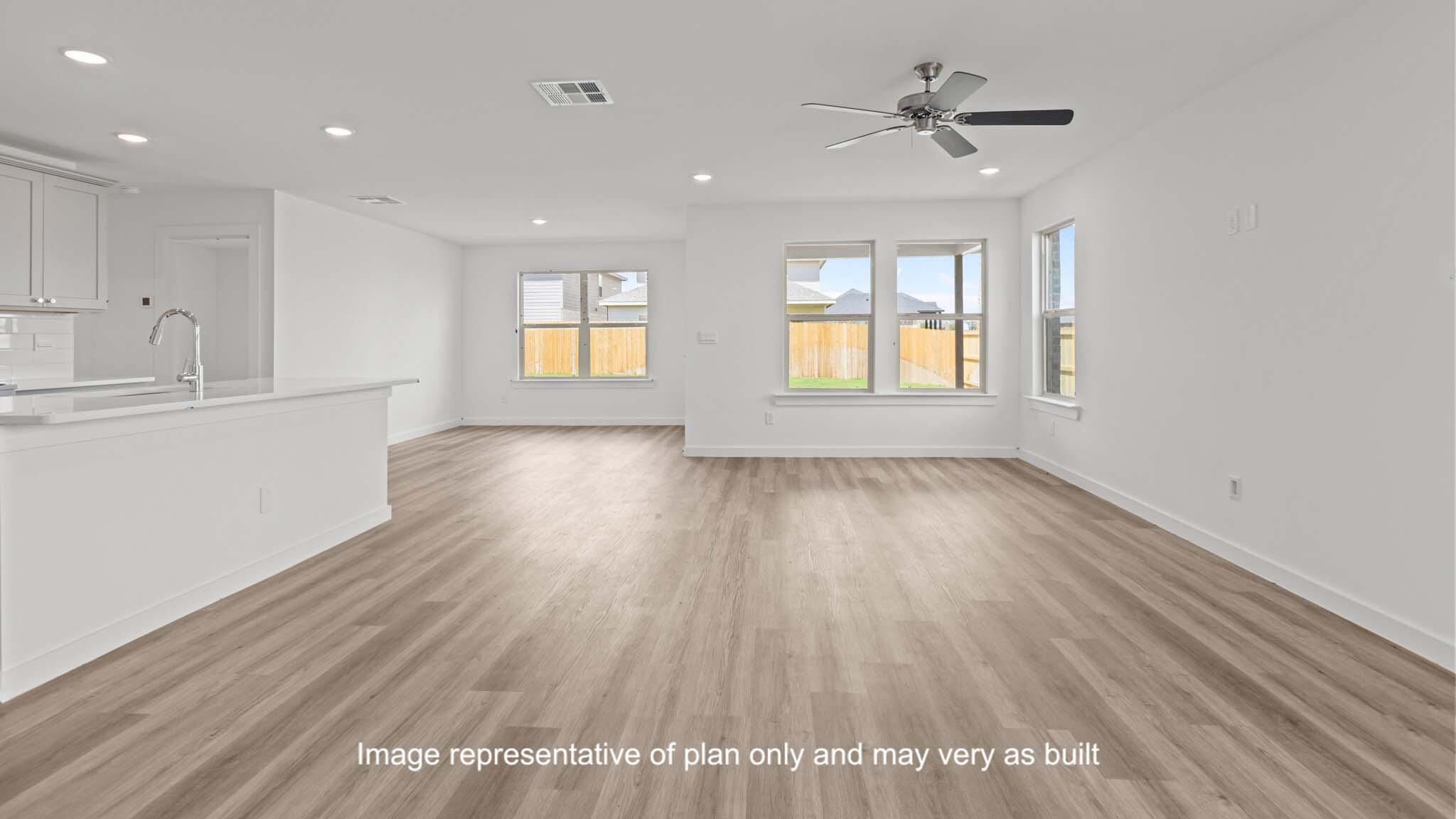 617 East 15th Street Wolfforth, TX 79382 - Photo 5 of 33 a view of an empty room with a window and wooden floor