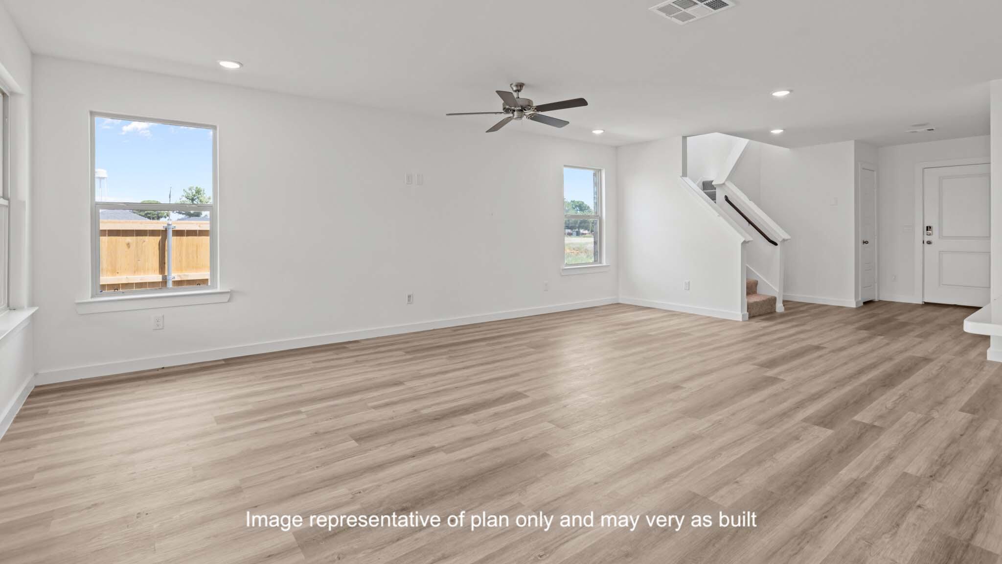 617 East 15th Street Wolfforth, TX 79382 - Photo 7 of 33 a view of empty room with wooden floor and fan