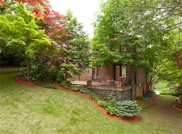 15 Oakvale Road Newton, MA 02468 - Photo 23 of 23 a front view of a house with garden