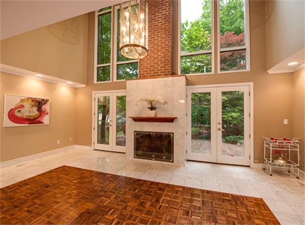 15 Oakvale Road Newton, MA 02468 - Photo 3 of 23 a view of an empty room with a fireplace and a window