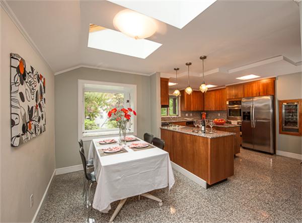 15 Oakvale Road Newton, MA 02468 - Photo 5 of 23 a dining room with a large window table and chairs