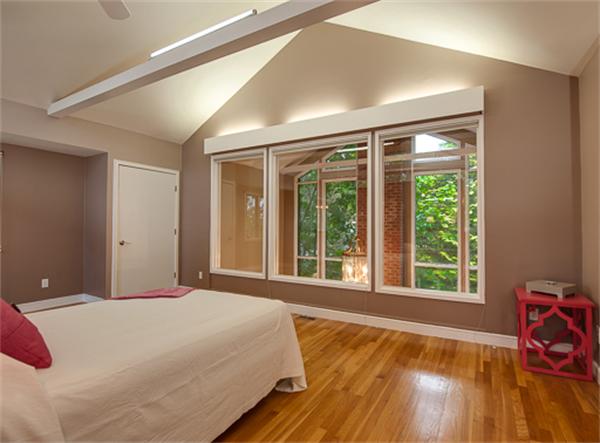 15 Oakvale Road Newton, MA 02468 - Photo 6 of 23 a bedroom with a bed and wooden floor