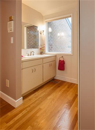 15 Oakvale Road Newton, MA 02468 - Photo 8 of 23 a spacious bathroom with a sink mirror and window