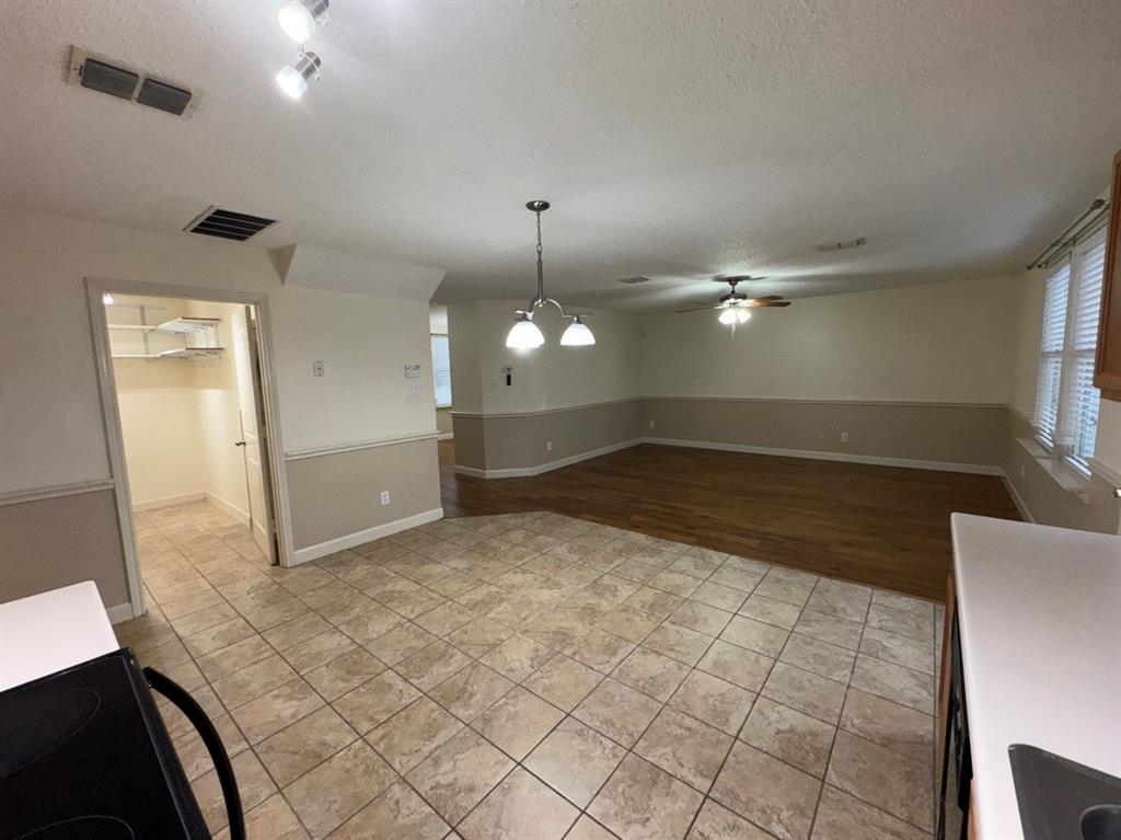2024 Brazos Court Grand Prairie, TX 75052 - Photo 15 of 40 a view of a kitchen with a sink and cabinets