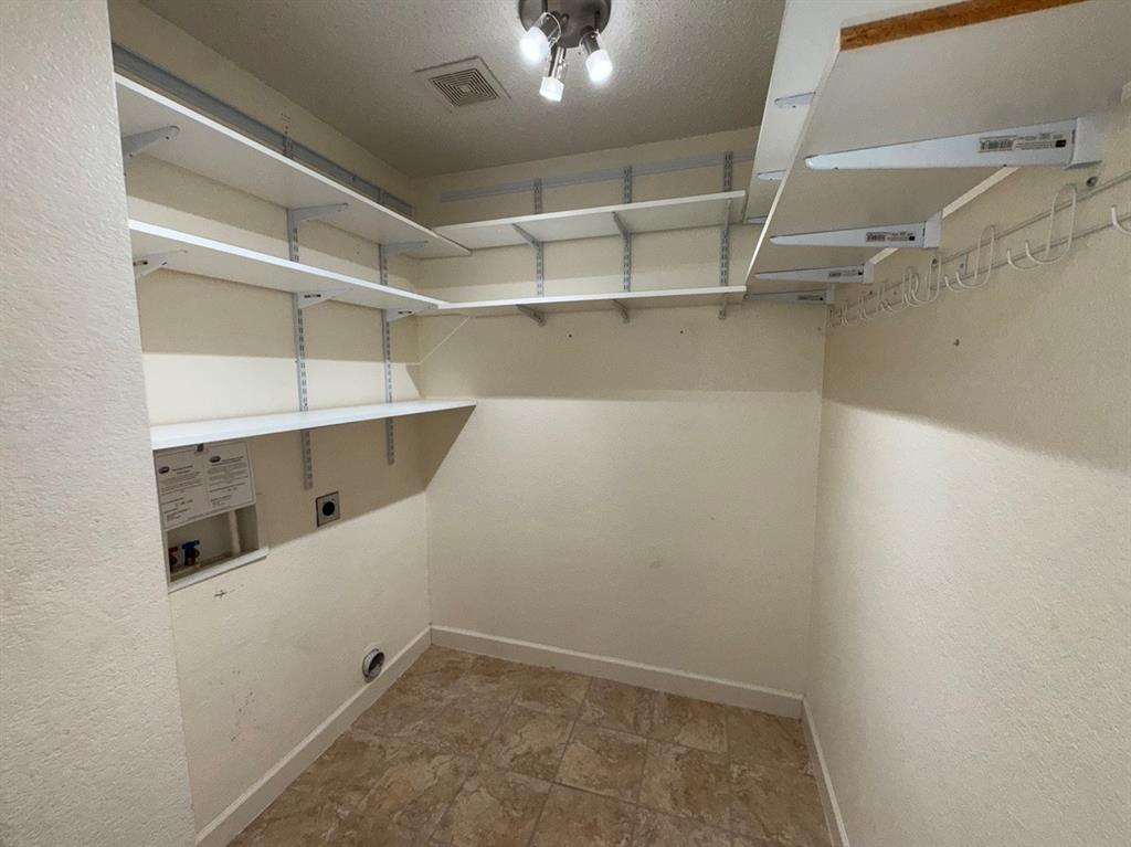 2024 Brazos Court Grand Prairie, TX 75052 - Photo 20 of 40 a view of a room with racks on the wall