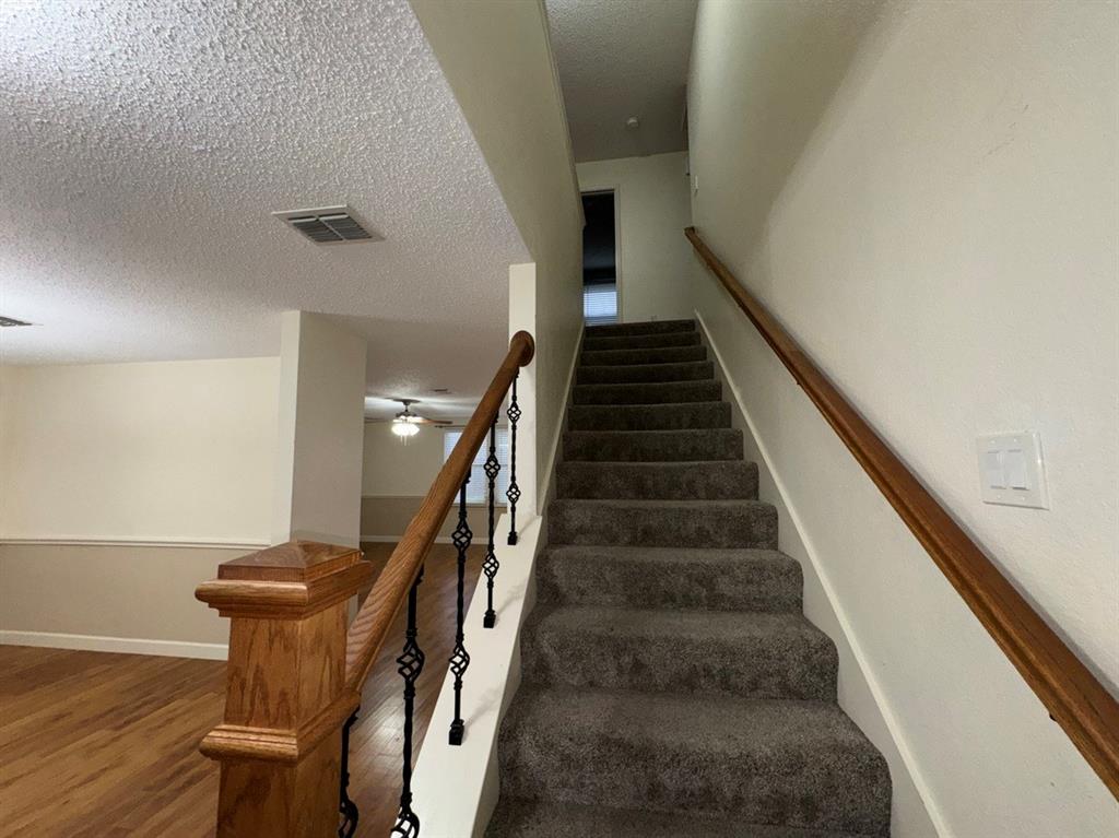 2024 Brazos Court Grand Prairie, TX 75052 - Photo 22 of 40 a view of entryway and hall with wooden floor