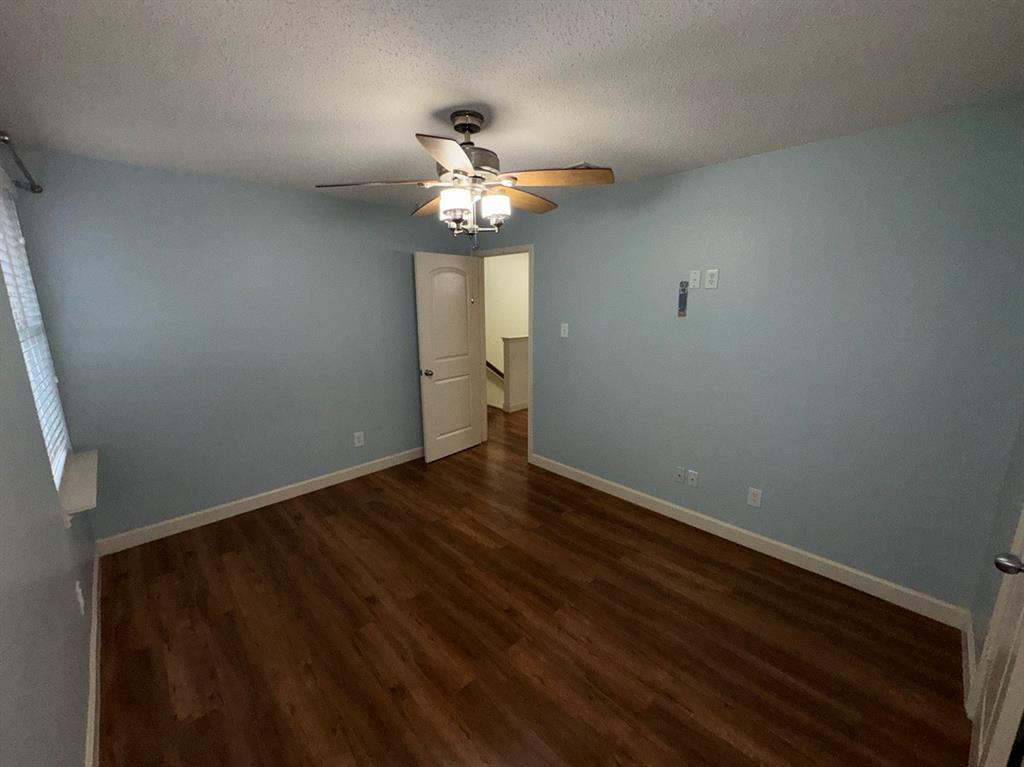 2024 Brazos Court Grand Prairie, TX 75052 - Photo 26 of 40 wooden floor in an empty room with a window