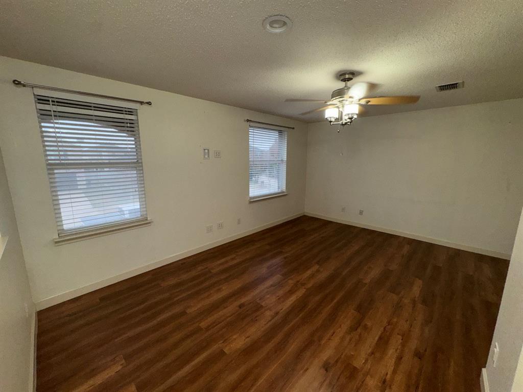 2024 Brazos Court Grand Prairie, TX 75052 - Photo 28 of 40 a view of room with natural light and wooden floor