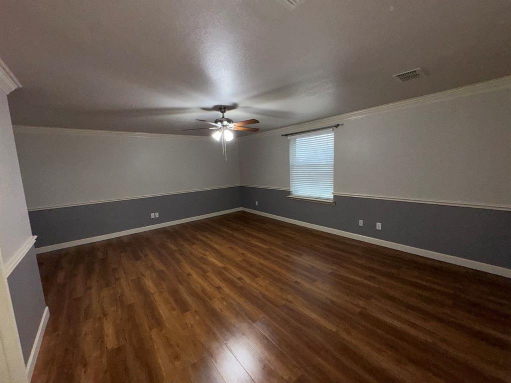 2024 Brazos Court Grand Prairie, TX 75052 - Photo 32 of 40 wooden floor in an empty room with a window