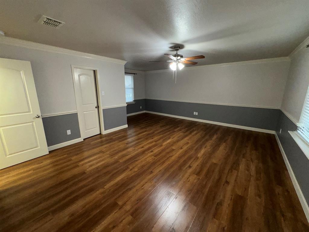 2024 Brazos Court Grand Prairie, TX 75052 - Photo 33 of 40 wooden floor in an empty room with a window
