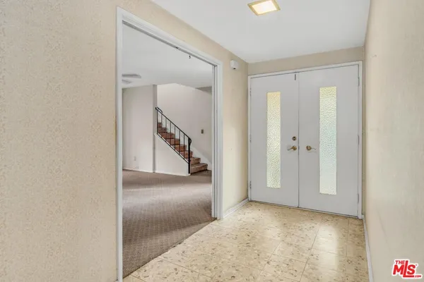 a view of a hallway with entryway