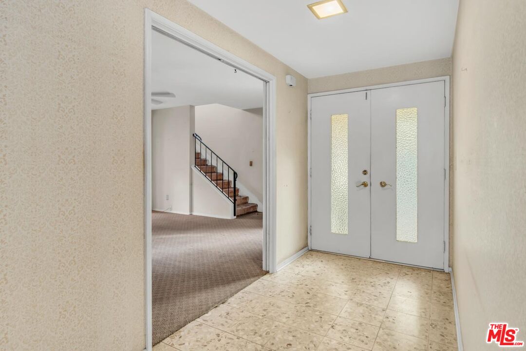 11258 Yolanda Avenue Porter Ranch, CA 91326 - Photo 13 of 46 a view of a hallway with entryway