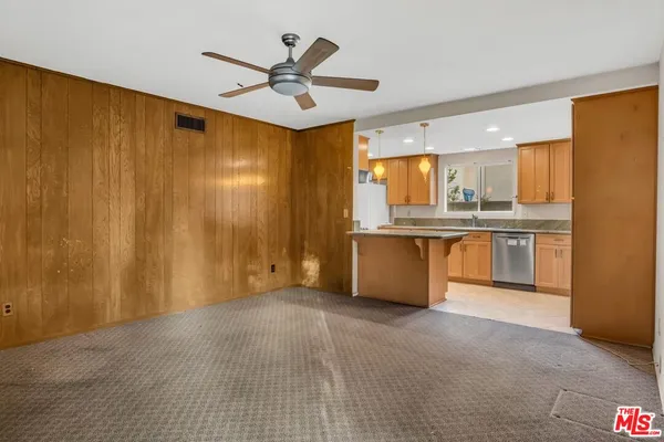 a view of a kitchen with a sink and cabinet