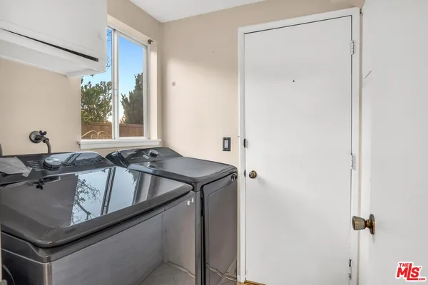 a kitchen with a sink and a refrigerator