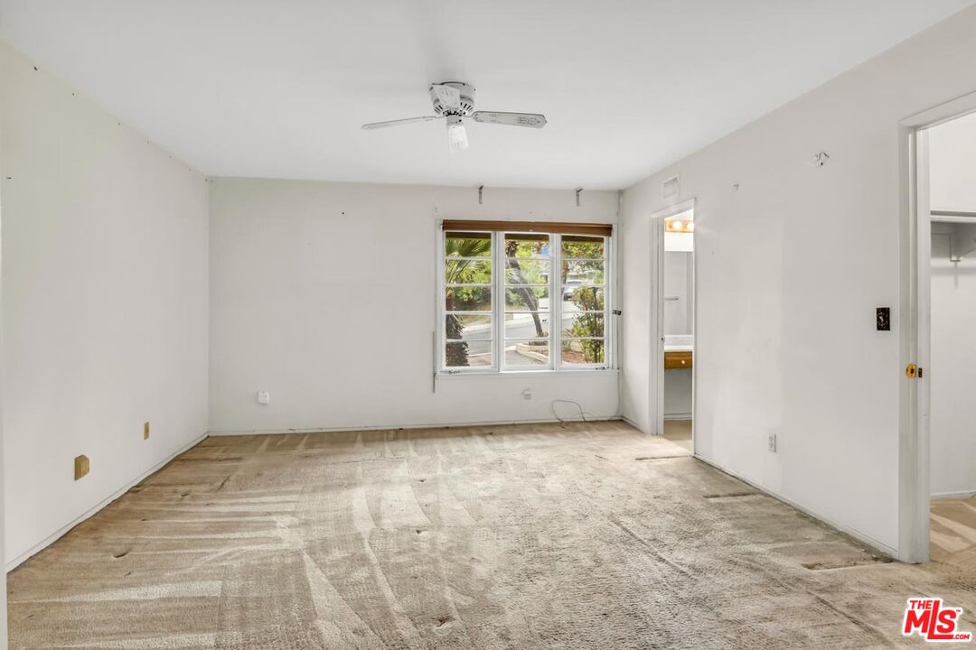 11258 Yolanda Avenue Porter Ranch, CA 91326 - Photo 21 of 46 a view of an empty room with a window