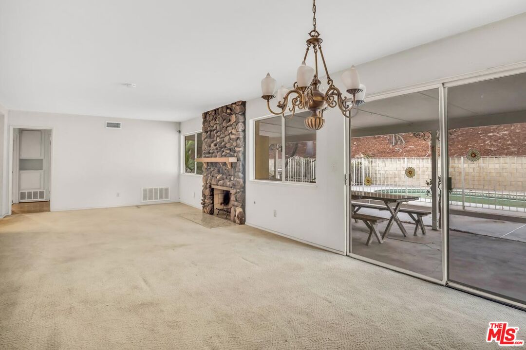 11258 Yolanda Avenue Porter Ranch, CA 91326 - Photo 27 of 46 a view of a room with window and chandelier