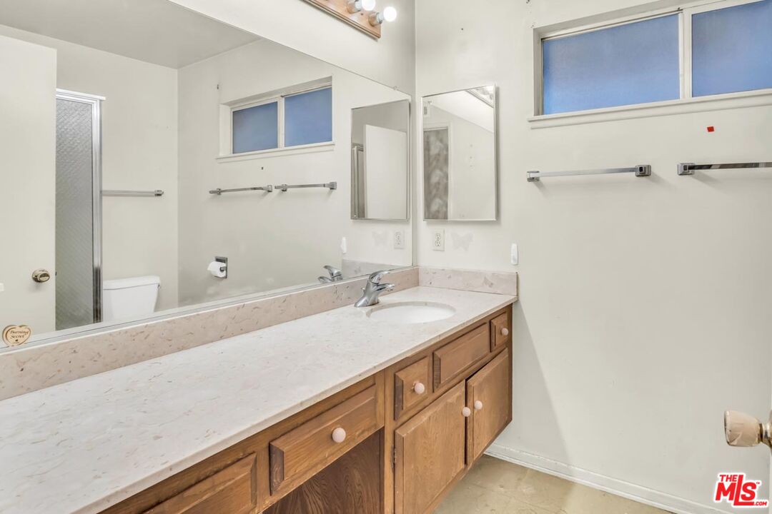 11258 Yolanda Avenue Porter Ranch, CA 91326 - Photo 37 of 46 a bathroom with a sink and a mirror