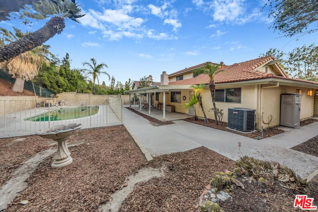 11258 Yolanda Avenue Porter Ranch, CA 91326 - Photo 46 of 46 a view of a house with a yard