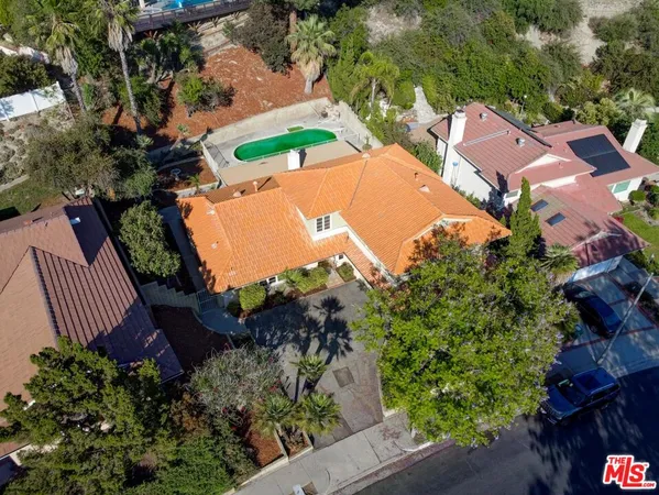 an aerial view of a house a yard and a garden