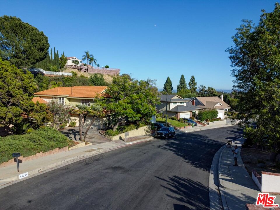 11258 Yolanda Avenue Porter Ranch, CA 91326 - Photo 10 of 46 an aerial view of a house having yard