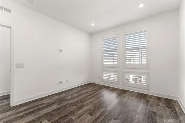 a spacious bathroom with a double vanity sink a mirror and a shower